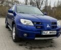 Синий Мицубиси Аутлендер, объемом двигателя 2.4 л и пробегом 243 тыс. км за 5000 $, фото 3 на Automoto.ua