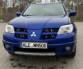 Синий Мицубиси Аутлендер, объемом двигателя 2.4 л и пробегом 243 тыс. км за 5000 $, фото 2 на Automoto.ua