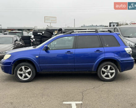Синий Мицубиси Аутлендер, объемом двигателя 2.4 л и пробегом 245 тыс. км за 4600 $, фото 2 на Automoto.ua