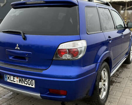 Синий Мицубиси Аутлендер, объемом двигателя 2.4 л и пробегом 243 тыс. км за 5000 $, фото 16 на Automoto.ua