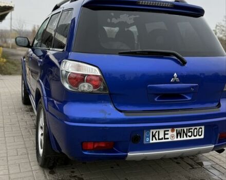 Синий Мицубиси Аутлендер, объемом двигателя 2.4 л и пробегом 243 тыс. км за 5000 $, фото 14 на Automoto.ua