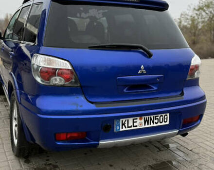 Синий Мицубиси Аутлендер, объемом двигателя 2.4 л и пробегом 243 тыс. км за 5000 $, фото 15 на Automoto.ua