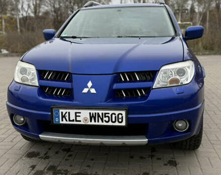 Синий Мицубиси Аутлендер, объемом двигателя 2.4 л и пробегом 243 тыс. км за 5000 $, фото 2 на Automoto.ua