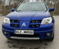 Синий Мицубиси Аутлендер, объемом двигателя 2.4 л и пробегом 243 тыс. км за 5000 $, фото 2 на Automoto.ua