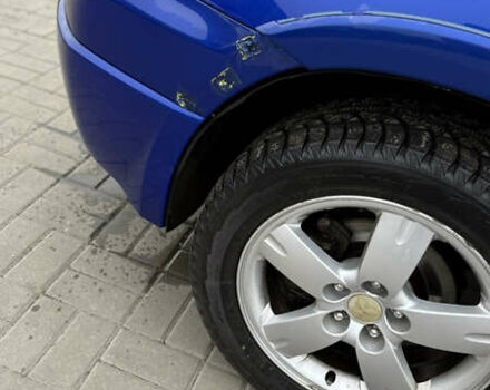 Синий Мицубиси Аутлендер, объемом двигателя 2.4 л и пробегом 243 тыс. км за 5000 $, фото 6 на Automoto.ua