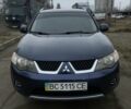 Синий Мицубиси Аутлендер, объемом двигателя 2.4 л и пробегом 250 тыс. км за 6300 $, фото 1 на Automoto.ua