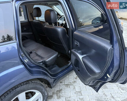 Синий Мицубиси Аутлендер, объемом двигателя 2 л и пробегом 228 тыс. км за 8888 $, фото 32 на Automoto.ua