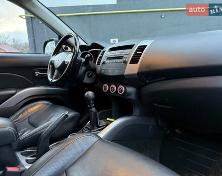 Синий Мицубиси Аутлендер, объемом двигателя 2 л и пробегом 228 тыс. км за 8888 $, фото 41 на Automoto.ua