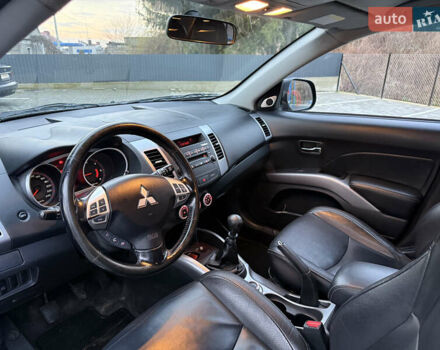 Синий Мицубиси Аутлендер, объемом двигателя 2 л и пробегом 228 тыс. км за 8888 $, фото 23 на Automoto.ua