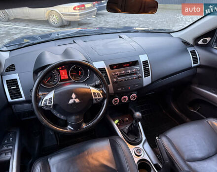 Синий Мицубиси Аутлендер, объемом двигателя 2 л и пробегом 228 тыс. км за 8888 $, фото 28 на Automoto.ua