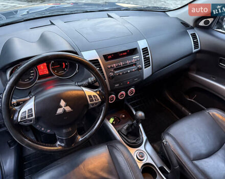 Синий Мицубиси Аутлендер, объемом двигателя 2 л и пробегом 228 тыс. км за 8888 $, фото 26 на Automoto.ua