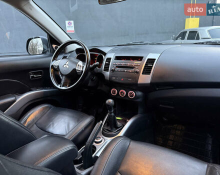 Синий Мицубиси Аутлендер, объемом двигателя 2 л и пробегом 228 тыс. км за 8888 $, фото 34 на Automoto.ua