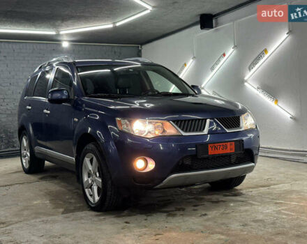 Синий Мицубиси Аутлендер, объемом двигателя 2 л и пробегом 228 тыс. км за 7999 $, фото 1 на Automoto.ua