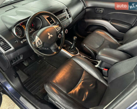 Синий Мицубиси Аутлендер, объемом двигателя 2 л и пробегом 228 тыс. км за 7999 $, фото 19 на Automoto.ua