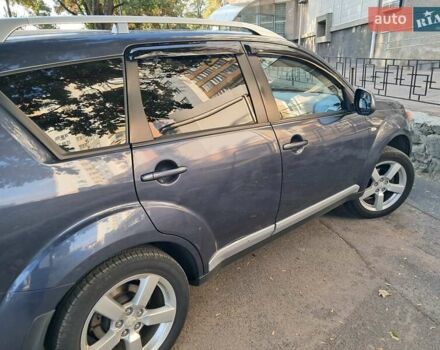 Синий Мицубиси Аутлендер, объемом двигателя 2.4 л и пробегом 160 тыс. км за 8800 $, фото 4 на Automoto.ua