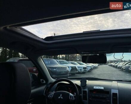 Синій Міцубісі Аутлендер, об'ємом двигуна 2.36 л та пробігом 282 тис. км за 9490 $, фото 43 на Automoto.ua