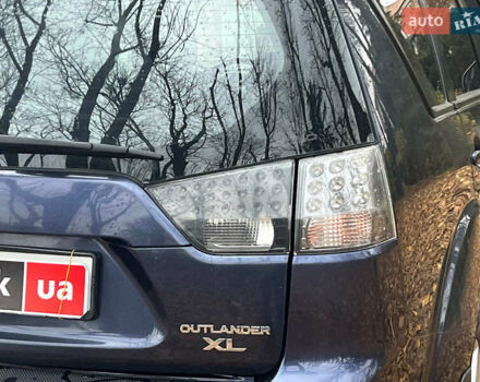 Синій Міцубісі Аутлендер, об'ємом двигуна 2.4 л та пробігом 211 тис. км за 8390 $, фото 10 на Automoto.ua