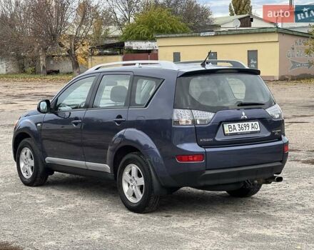 Синий Мицубиси Аутлендер, объемом двигателя 2.4 л и пробегом 94 тыс. км за 8800 $, фото 1 на Automoto.ua