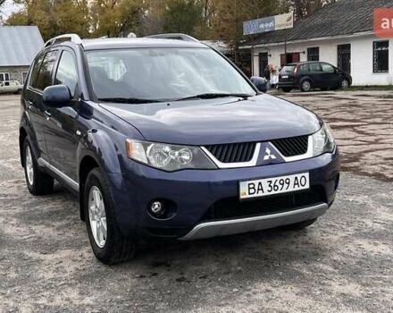 Синий Мицубиси Аутлендер, объемом двигателя 2.4 л и пробегом 94 тыс. км за 8800 $, фото 3 на Automoto.ua