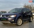 Синій Міцубісі Аутлендер, об'ємом двигуна 2.36 л та пробігом 282 тис. км за 9490 $, фото 1 на Automoto.ua