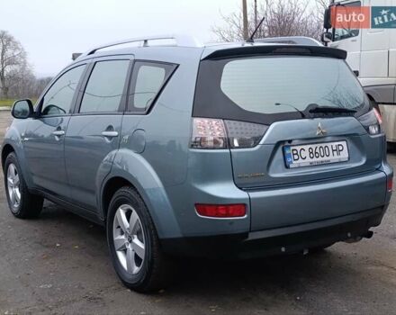 Синий Мицубиси Аутлендер, объемом двигателя 2.4 л и пробегом 264 тыс. км за 7555 $, фото 1 на Automoto.ua