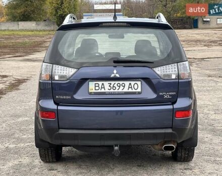 Синий Мицубиси Аутлендер, объемом двигателя 2.4 л и пробегом 94 тыс. км за 8800 $, фото 2 на Automoto.ua