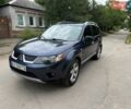 Синій Міцубісі Аутлендер, об'ємом двигуна 2.36 л та пробігом 269 тис. км за 7750 $, фото 1 на Automoto.ua