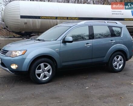 Синий Мицубиси Аутлендер, объемом двигателя 2.4 л и пробегом 264 тыс. км за 7555 $, фото 4 на Automoto.ua