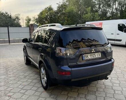Синий Мицубиси Аутлендер, объемом двигателя 2.36 л и пробегом 223 тыс. км за 8650 $, фото 6 на Automoto.ua