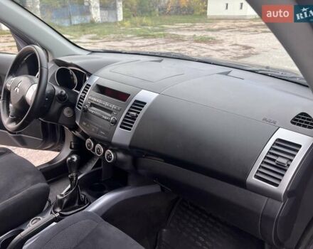 Синий Мицубиси Аутлендер, объемом двигателя 2.4 л и пробегом 94 тыс. км за 8800 $, фото 7 на Automoto.ua