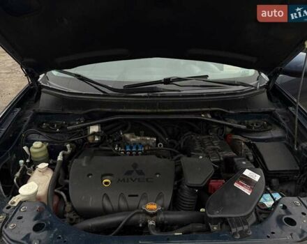 Синий Мицубиси Аутлендер, объемом двигателя 2.4 л и пробегом 211 тыс. км за 7800 $, фото 1 на Automoto.ua