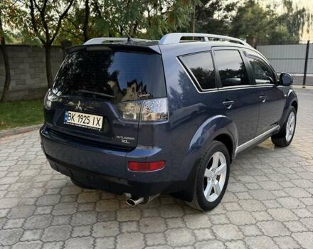 Синий Мицубиси Аутлендер, объемом двигателя 2.36 л и пробегом 223 тыс. км за 8650 $, фото 4 на Automoto.ua