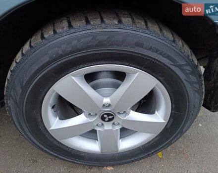 Синий Мицубиси Аутлендер, объемом двигателя 2.4 л и пробегом 264 тыс. км за 7555 $, фото 44 на Automoto.ua