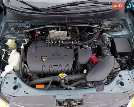 Синий Мицубиси Аутлендер, объемом двигателя 2.4 л и пробегом 264 тыс. км за 7555 $, фото 43 на Automoto.ua