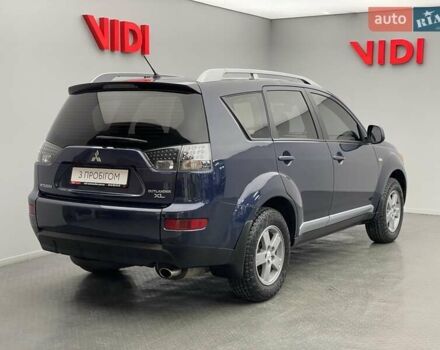 Синій Міцубісі Аутлендер, об'ємом двигуна 2.4 л та пробігом 126 тис. км за 10438 $, фото 1 на Automoto.ua