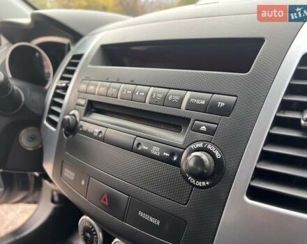 Синий Мицубиси Аутлендер, объемом двигателя 2.4 л и пробегом 94 тыс. км за 8800 $, фото 5 на Automoto.ua