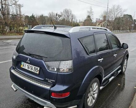 Синій Міцубісі Аутлендер, об'ємом двигуна 2.4 л та пробігом 282 тис. км за 10500 $, фото 1 на Automoto.ua