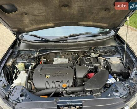 Синий Мицубиси Аутлендер, объемом двигателя 2.36 л и пробегом 223 тыс. км за 8650 $, фото 21 на Automoto.ua