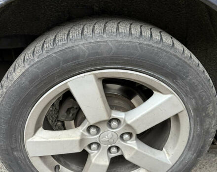 Синий Мицубиси Аутлендер, объемом двигателя 2.36 л и пробегом 269 тыс. км за 7500 $, фото 5 на Automoto.ua