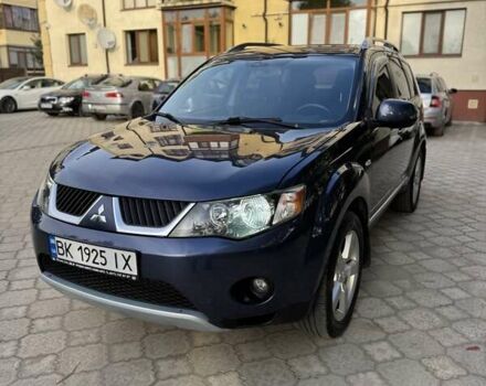 Синий Мицубиси Аутлендер, объемом двигателя 2.36 л и пробегом 223 тыс. км за 8650 $, фото 1 на Automoto.ua