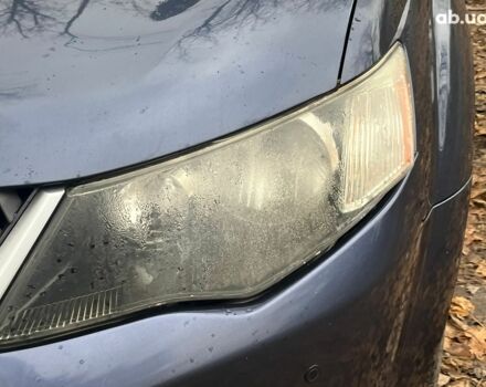 Синій Міцубісі Аутлендер, об'ємом двигуна 2.4 л та пробігом 211 тис. км за 8390 $, фото 4 на Automoto.ua