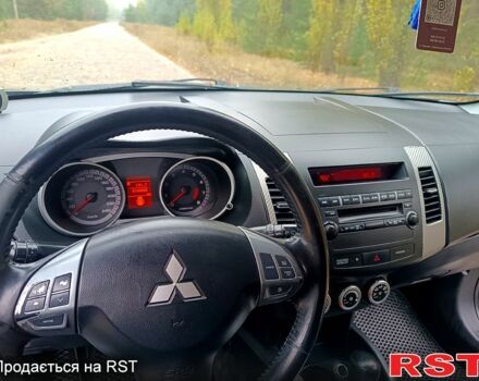 Синій Міцубісі Аутлендер, об'ємом двигуна 2.4 л та пробігом 210 тис. км за 8100 $, фото 1 на Automoto.ua