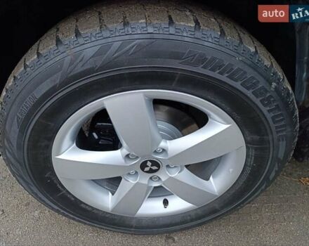 Синий Мицубиси Аутлендер, объемом двигателя 2.4 л и пробегом 264 тыс. км за 7555 $, фото 42 на Automoto.ua