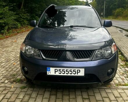 Синий Мицубиси Аутлендер, объемом двигателя 2.4 л и пробегом 284 тыс. км за 9250 $, фото 2 на Automoto.ua