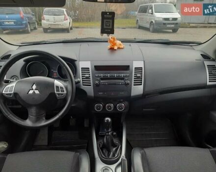 Синий Мицубиси Аутлендер, объемом двигателя 2 л и пробегом 200 тыс. км за 10500 $, фото 24 на Automoto.ua