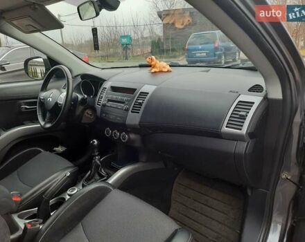 Синий Мицубиси Аутлендер, объемом двигателя 2 л и пробегом 200 тыс. км за 10500 $, фото 26 на Automoto.ua