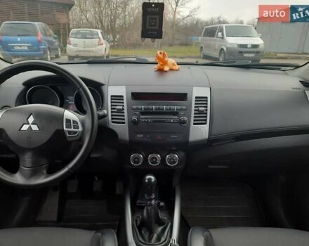 Синий Мицубиси Аутлендер, объемом двигателя 2 л и пробегом 200 тыс. км за 10500 $, фото 23 на Automoto.ua