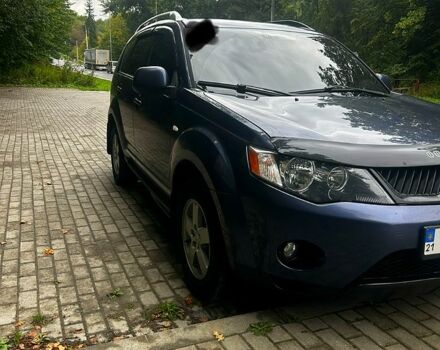 Синий Мицубиси Аутлендер, объемом двигателя 2.4 л и пробегом 284 тыс. км за 9250 $, фото 1 на Automoto.ua