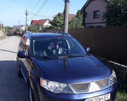 Синий Мицубиси Аутлендер, объемом двигателя 2.18 л и пробегом 205 тыс. км за 11000 $, фото 2 на Automoto.ua