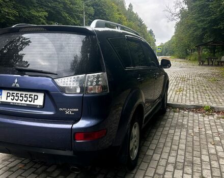 Синий Мицубиси Аутлендер, объемом двигателя 2.4 л и пробегом 284 тыс. км за 9250 $, фото 3 на Automoto.ua